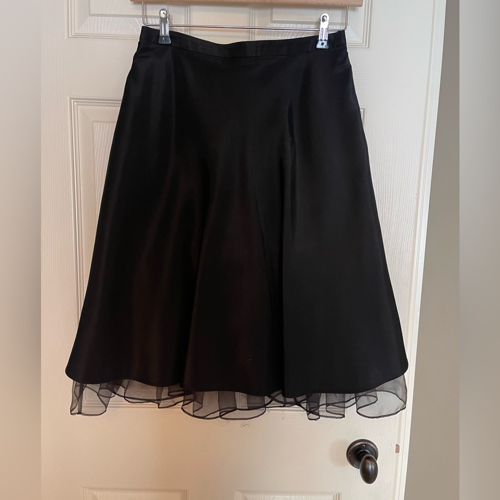 Black taffeta skirt with built in crinoline. Size 6